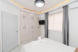 En eller flere senge i et værelse på Cozy 1BR 1BA Bayahibe Getaway with Pool - Maravilla + 18 billeder