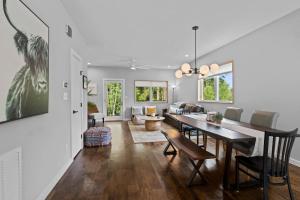 a dining room and living room with a table and chairs at On Cloud Durham Unit B in Durham