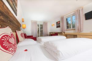 Rúm í herbergi á Hotel Gasthof Weiherbad