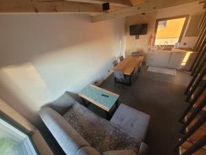 an overhead view of a living room with a couch and a table at Jodłowy domek na Roztoczu in Obrocz