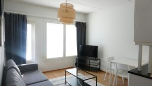 TV a/nebo společenská místnost v ubytování Convenient Apartment for 2 with Sauna