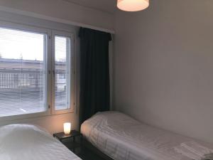 Katil atau katil-katil dalam bilik di Spacious Apartment for 6 with Sauna