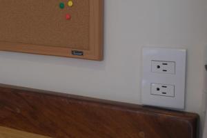 a white electrical outlet on a white wall at Sayulita beach-side studio 2 by CasasTropical in Sayulita