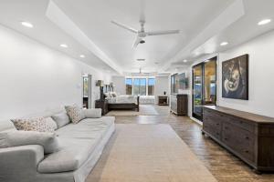 a living room with a couch and a table at Private Gated 6BR Luxury Estate, Gym, Lake View in Del Dios
