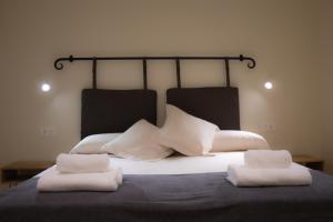 a bed with two white pillows on top of it at Luminoso Bilbao in Bilbao