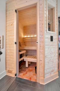 a wooden sauna with a bench inside of it at Wilson Park Spa home sauna and walking trails in Fayetteville