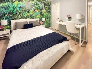 a bedroom with a large bed and two desks at The Stay at Steuben Fire Pit Brand new furniture in Springdale +13 photos