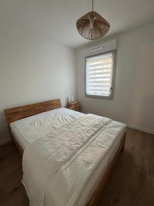 Ένα ή περισσότερα κρεβάτια σε δωμάτιο στο Appartement neuf