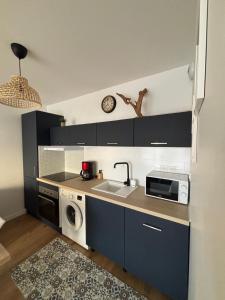 Η κουζίνα ή μικρή κουζίνα στο Appartement neuf