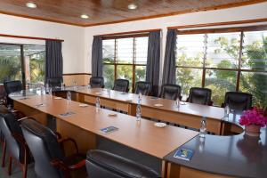 a conference room with a long table and chairs at Lake Kariba Inns in Siavonga