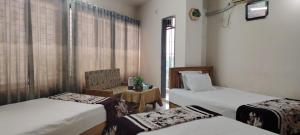 Postel nebo postele na pokoji v ubytování Hotel Sikder Residential - হোটেল শিকদার আবাসিক