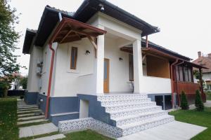 a house with stairs in front of it at Citadelle house in Alba Iulia