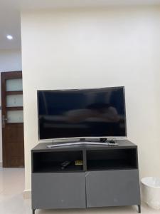 a flat screen tv sitting on top of a entertainment center at haya abdun in Amman