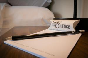 a pen sitting on top of a paper on a table at Seaside Studio 1BR near the Malecon in Miraflores in Lima +1 photo