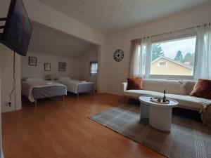 a living room with a couch and a table at Vista in Vaasa