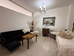 a living room with a couch and a table at YouHouse Paraná in Buenos Aires