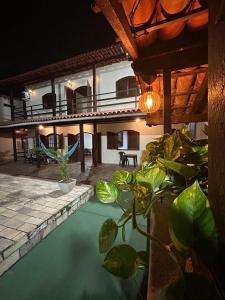 Imagen de la galería de Villa Palmeiras Suítes, en Cabo Frío