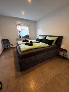 a large bed in a room with at Quartier 4 - modern und mit bester Verkehrsanbindung in Oberhausen