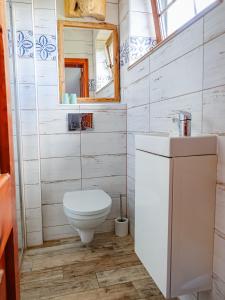 a bathroom with a toilet and a sink at Klimbergowice in Sztum +28 photos