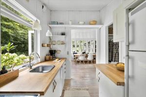 a kitchen with a sink and a counter top at 1183-N-Frederiksvaerk-Plovvaenget-6 in Asserbo