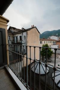 a view from the balcony of a building at ComoLakeHouse in Como
