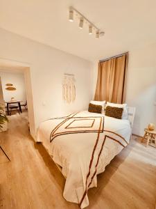 a bedroom with a large bed in a room at Casa Lairesse in Liège