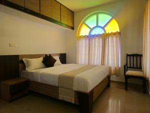 Katil atau katil-katil dalam bilik di Hestia chalet 3BHK Ooty