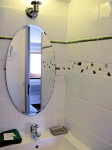 a bathroom with a mirror over a sink at Un cadre magnifique, au coeur du Verdon in Castellane