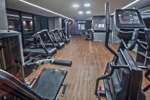 a gym with a row of treadmills and machines at Studio 818 no edf. TIME, Ponta Verde in Maceió