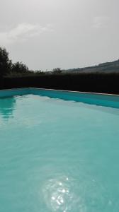 The swimming pool at or close to Il Gallo Del Vicino