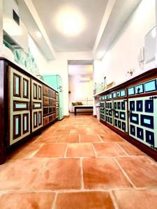a room with a tiled floor and a couch at Casa Basilia in Granada
