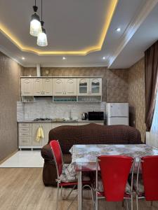 Kuchyň nebo kuchyňský kout v ubytování Tea's Condo in Saburtalo