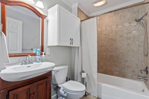 a bathroom with a sink and a toilet and a shower at Runway Paradise in Zwolle +19 photos