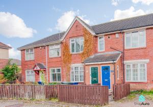 a red brick house with a blue door at Modern 2 Bed in Newcastle, Free Parking & Sleeps 6 in Kenton