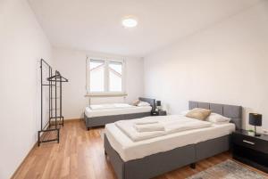 Postel nebo postele na pokoji v ubytování HAVENU Heilbronn Dammstraße + 10 fotografií