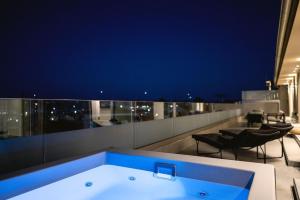a bath tub sitting on top of a building at Zeus Jacuzzi Sea View Rooftop in Kontokali