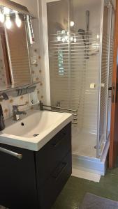 a bathroom with a sink and a shower at B&B ABBAZIA Sant'ELENA in Serra San Quirico
