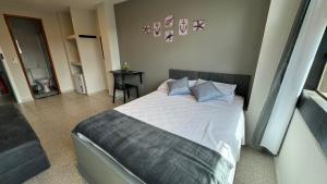 Ένα ή περισσότερα κρεβάτια σε δωμάτιο στο Êxito Loft