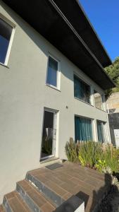 a house with a brick walkway in front of it at Porto Vista Douro Apart in Valbom