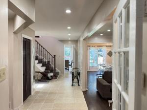 a hallway with a living room and a dining room at Stylish Mississauga Escape Near Downtown in Mississauga