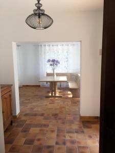 a living room with a table and a couch at Villa Defendum in Vallauris