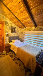 Postel nebo postele na pokoji v ubytování İsgobya Dağ Evleri + 3 fotografie