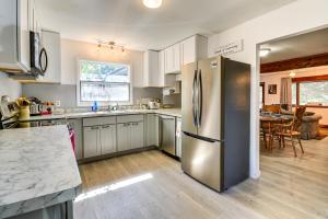 a kitchen with a stainless steel refrigerator at 7 Mi to Bighorn Natl Forest Dog-Friendly Home in Ranchester