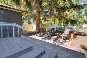 a group of chairs sitting on a patio under a tree at 7 Mi to Bighorn Natl Forest Dog-Friendly Home in Ranchester