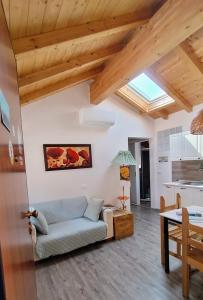 a living room with a couch and a table at Casa Vacanza L'Ulivo in Albenga