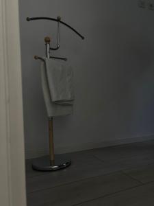a towel hanging on a towel rack in a room at Apartament M&B in Satu Mare