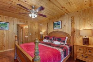 a bedroom with a bed and a ceiling fan at Sage Grass Retreat By Avada Properties in Line Spring