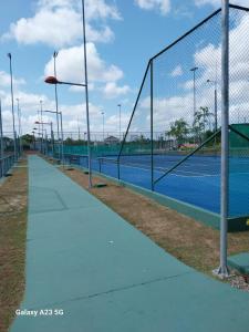 a tennis court with a net on a tennis court at COP 30 Luxury home in Belém! in Belém