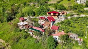 a group of houses on the side of a hill at İsgobya Dağ Evleri 107 in Macka