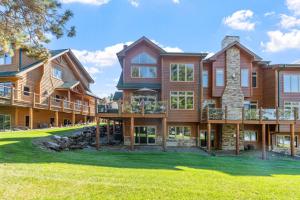 an image of a large house with a yard at Lakefront-sleep 12-big Sandy Lodge Resort-luxury in McGregor